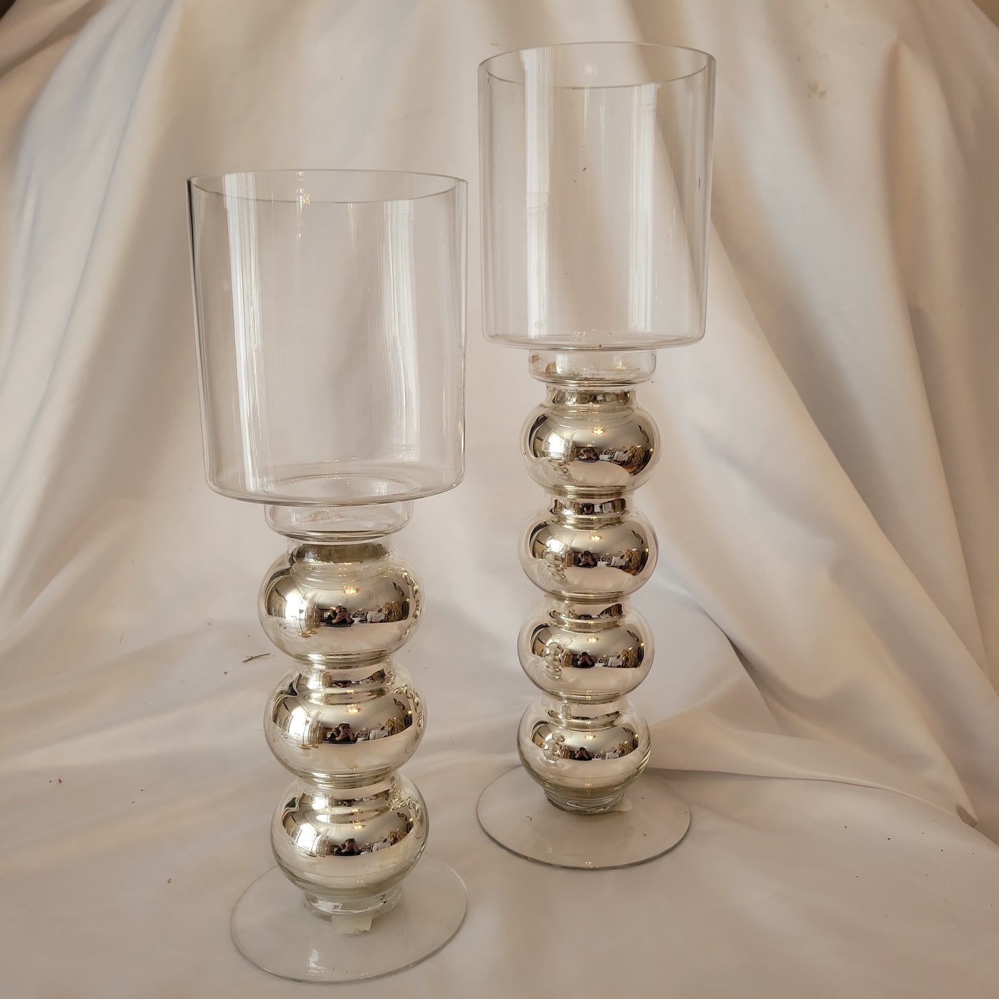 silver stemmed candle holders