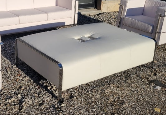 white ottoman with charging unit